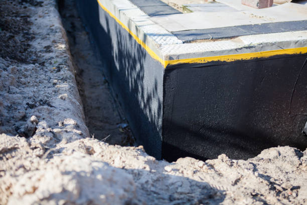 Professional Waterproofing technician working in Barnesville, OH